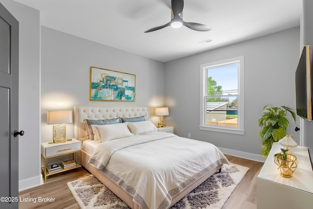 530-532 E Burnett Ave, Louisville, KY 40217 - bedroom with baseboards, wood finished floors, and a ceiling fan