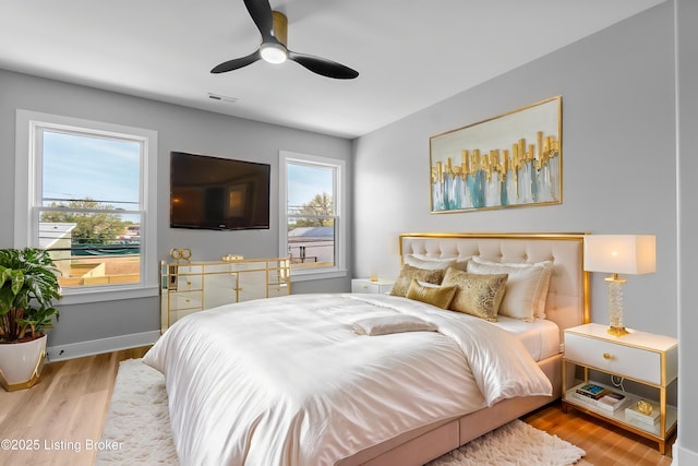 530-532 E Burnett Ave, Louisville, KY 40217 - bedroom featuring wood finished floors, a ceiling fan, and baseboards