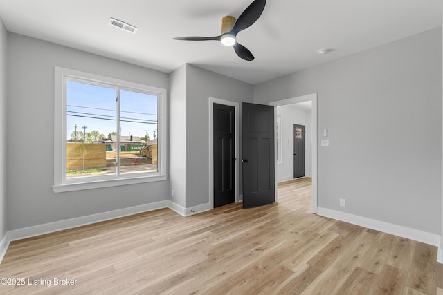 530-532 E Burnett Ave, Louisville, KY 40217 - unfurnished bedroom featuring light wood-style flooring, baseboards, and a ceiling fan