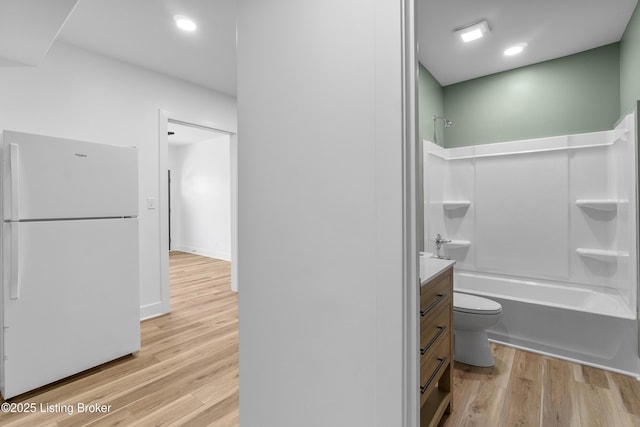 530-532 E Burnett Ave, Louisville, KY 40217 - full bath with wood finished floors,  shower combination, vanity, toilet, and recessed lighting