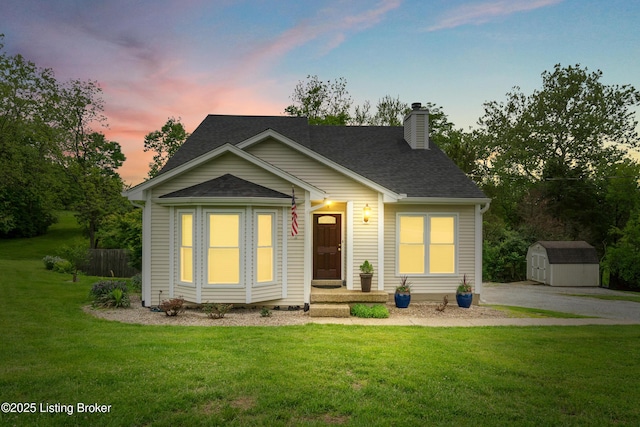 1900 Wolf Dr, La Grange, KY 40031 - view of front facade with a storage unit, a chimney, an outdoor structure, a yard, and roof with shingles