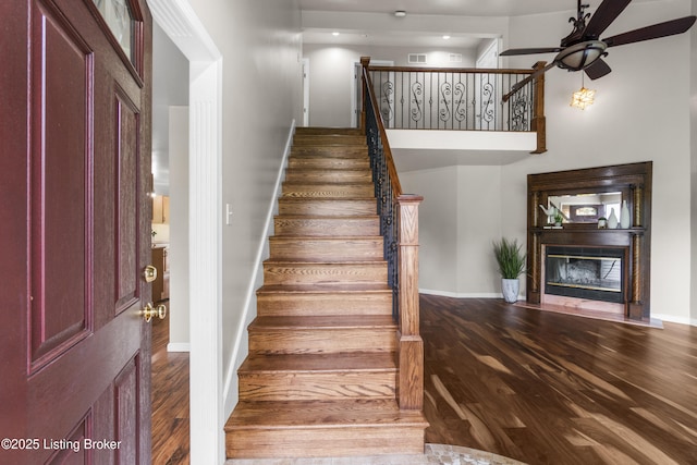 1900 Wolf Dr, La Grange, KY 40031 - stairs with a ceiling fan, wood finished floors, baseboards, and a glass covered fireplace