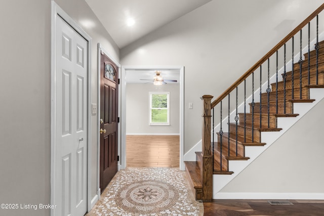 1900 Wolf Dr, La Grange, KY 40031 - entrance foyer with wood finished floors, a ceiling fan, vaulted ceiling, stairs, and baseboards