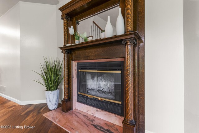 1900 Wolf Dr, La Grange, KY 40031 - detailed view of a glass covered fireplace, baseboards, and wood finished floors