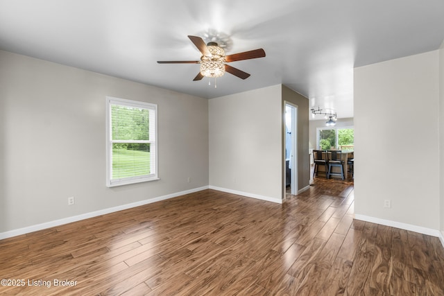 1900 Wolf Dr, La Grange, KY 40031 - unfurnished living room with wood finished floors, ceiling fan, and baseboards