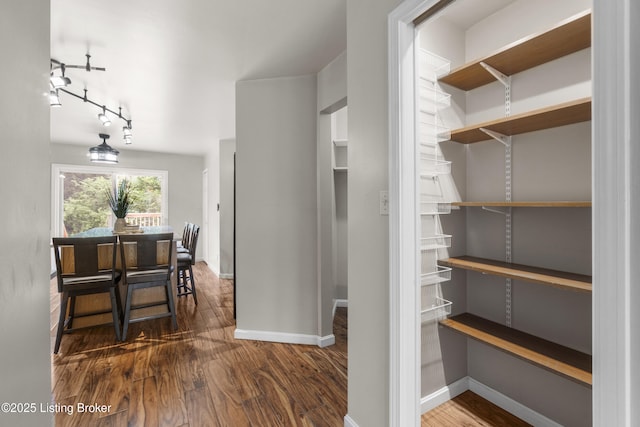 1900 Wolf Dr, La Grange, KY 40031 - corridor with wood finished floors, track lighting, and baseboards
