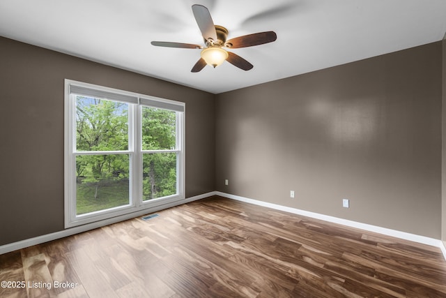 1900 Wolf Dr, La Grange, KY 40031 - empty room with dark wood-style floors, baseboards, and a ceiling fan