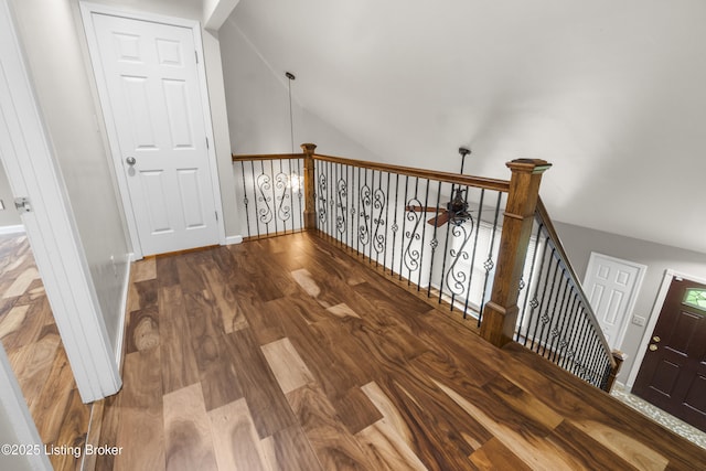 1900 Wolf Dr, La Grange, KY 40031 - hallway featuring vaulted ceiling, baseboards, wood finished floors, and an upstairs landing