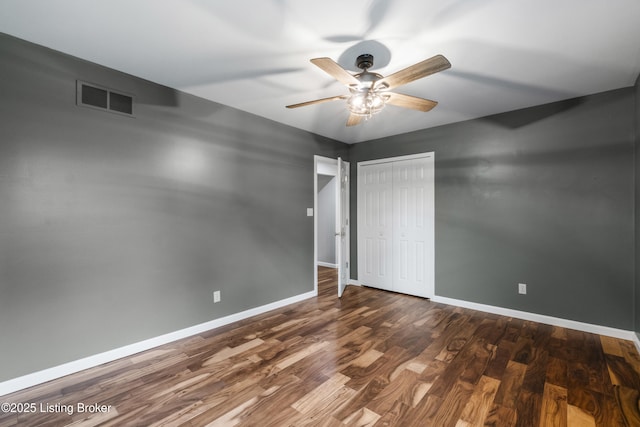 1900 Wolf Dr, La Grange, KY 40031 - unfurnished bedroom with baseboards, wood finished floors, a closet, and a ceiling fan