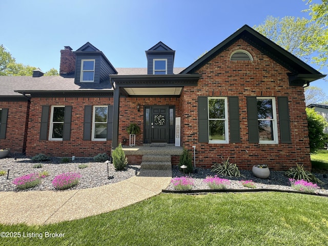 1609 Tall Oaks Dr, Jeffersonville, IN 47130 - view of front of property featuring brick siding, a chimney, and a front lawn