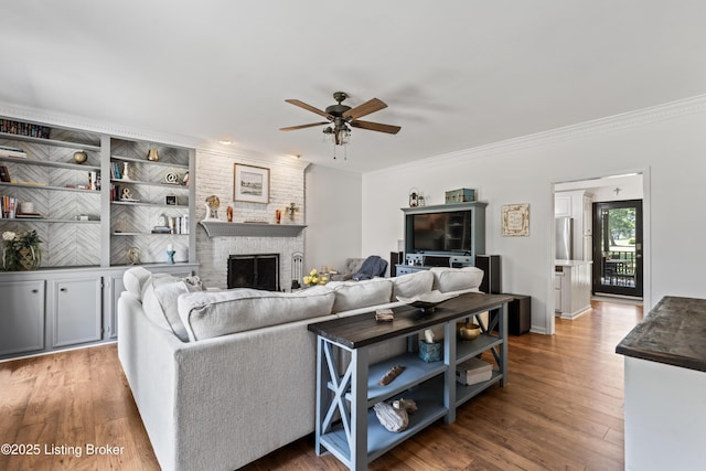 1609 Tall Oaks Dr, Jeffersonville, IN 47130 - living room with a ceiling fan, crown molding, wood finished floors, and a fireplace