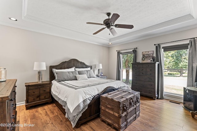 1609 Tall Oaks Dr, Jeffersonville, IN 47130 - bedroom with a tray ceiling, light wood-style flooring, crown molding, recessed lighting, and ceiling fan