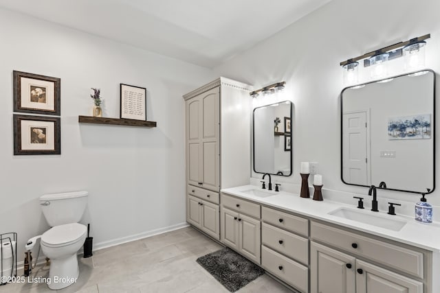 1609 Tall Oaks Dr, Jeffersonville, IN 47130 - bathroom with toilet, baseboards, and double vanity