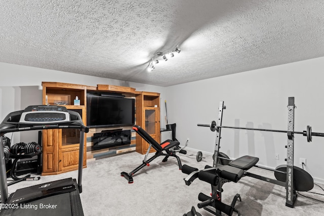 1609 Tall Oaks Dr, Jeffersonville, IN 47130 - workout room with a textured ceiling, carpet floors, and baseboards