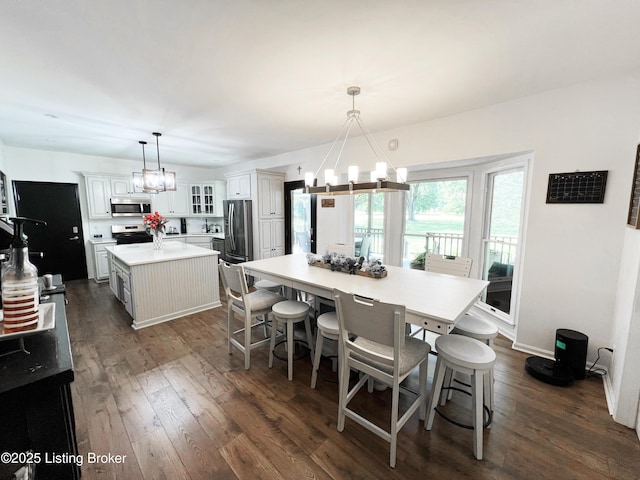 1609 Tall Oaks Dr, Jeffersonville, IN 47130 - dining room with a chandelier and dark wood-style floors