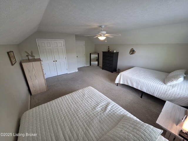 1609 Tall Oaks Dr, Jeffersonville, IN 47130 - carpeted bedroom with lofted ceiling, a textured ceiling, ceiling fan, a closet, and baseboards