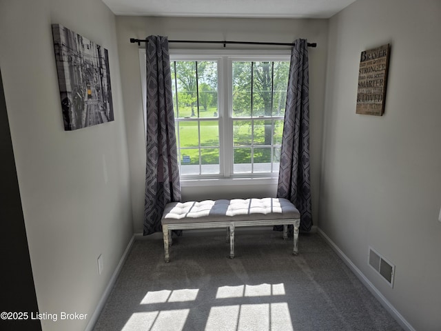 1609 Tall Oaks Dr, Jeffersonville, IN 47130 - sitting room with healthy amount of natural light, dark colored carpet, and baseboards