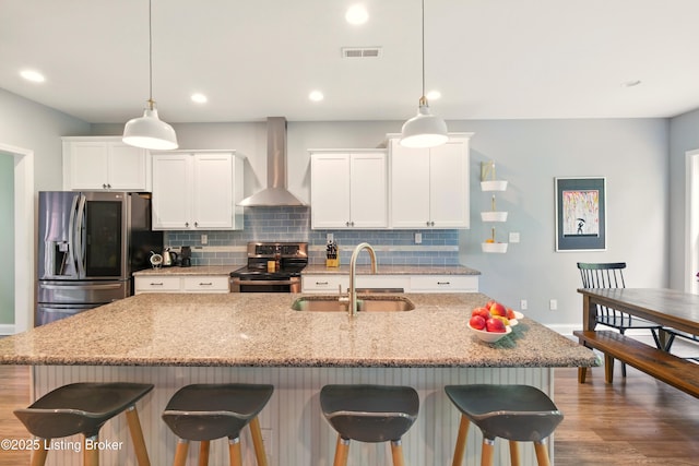 566 Wooded Falls Rd, Louisville, KY 40243 - kitchen with stainless steel appliances, wall chimney range hood, a sink, baseboards, and tasteful backsplash