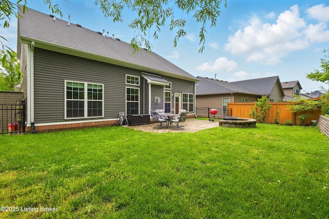 566 Wooded Falls Rd, Louisville, KY 40243 - back of property with a patio and roof with shingles
