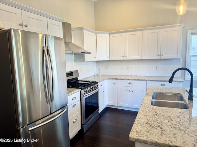 941 E Oak St, Louisville, KY 40204 - kitchen with stainless steel appliances, a sink, white cabinets, backsplash, and wall chimney range hood