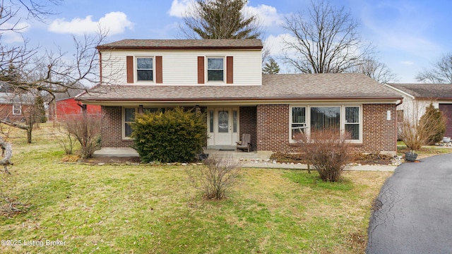 200 Castlerock Dr, Shepherdsville, KY 40165 - traditional-style house with a front yard, brick siding, and a porch