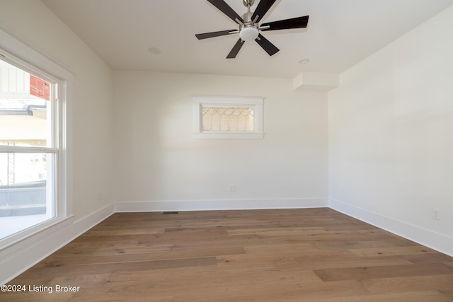 426 E Oak St, Louisville, KY 40203 - spare room with light wood-type flooring, baseboards, and a ceiling fan