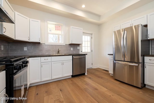 426 E Oak St, Louisville, KY 40203 - kitchen with stainless steel appliances, dark countertops, a sink, backsplash, and recessed lighting