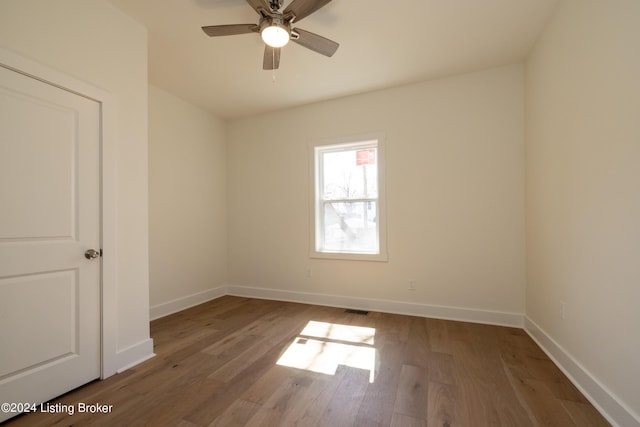 426 E Oak St, Louisville, KY 40203 - unfurnished room featuring wood finished floors, baseboards, and a ceiling fan