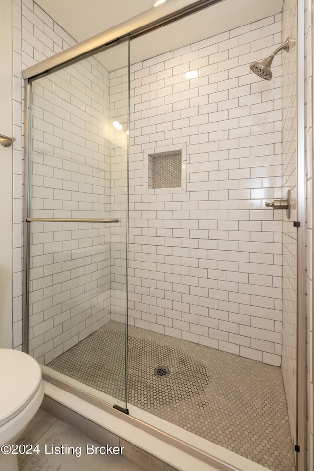 426 E Oak St, Louisville, KY 40203 - bathroom featuring a stall shower and toilet