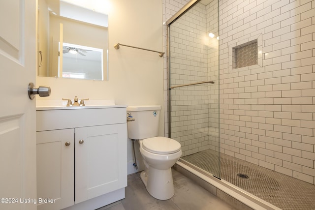 426 E Oak St, Louisville, KY 40203 - bathroom with a stall shower, toilet, vanity, and ceiling fan