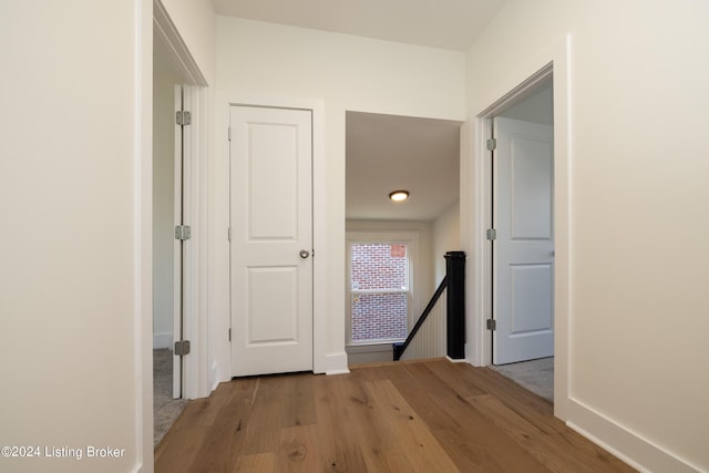 426 E Oak St, Louisville, KY 40203 - hall with an upstairs landing, wood finished floors, and baseboards