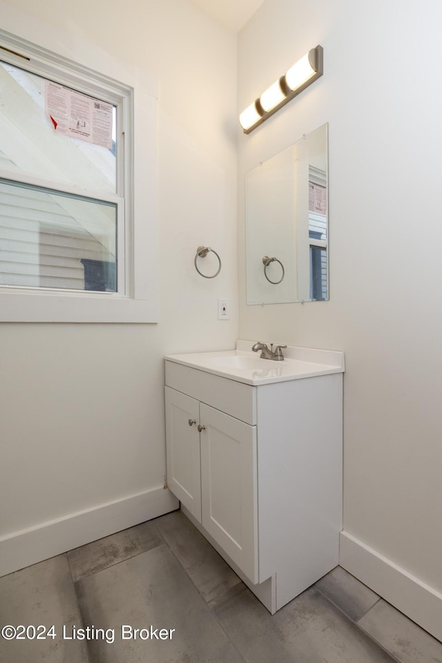 426 E Oak St, Louisville, KY 40203 - bathroom with baseboards and vanity