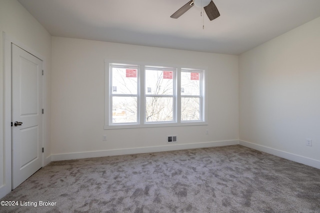 426 E Oak St, Louisville, KY 40203 - empty room with carpet flooring, ceiling fan, and baseboards