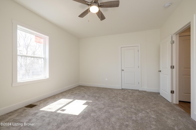 426 E Oak St, Louisville, KY 40203 - unfurnished bedroom featuring carpet floors, baseboards, and ceiling fan