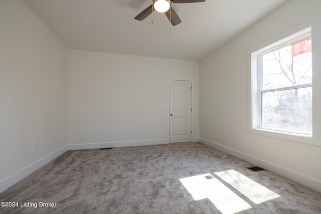 426 E Oak St, Louisville, KY 40203 - carpeted empty room featuring plenty of natural light, ceiling fan, and baseboards