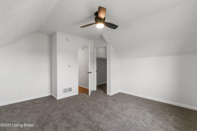 228 Schlaefer Way, Rineyville, KY 40162 - bonus room with vaulted ceiling, dark carpet, a ceiling fan, baseboards, and a textured ceiling