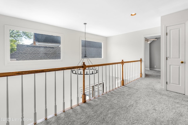 hallway with carpet flooring, recessed lighting, and baseboards
