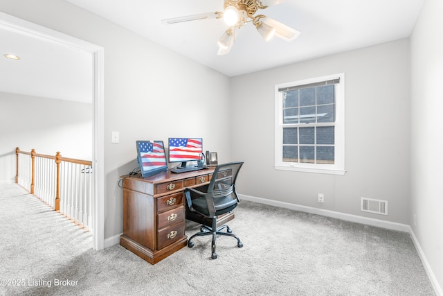 home office with carpet, baseboards, and a ceiling fan