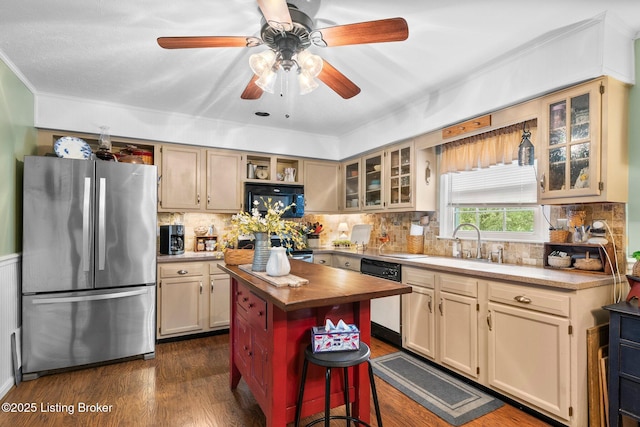 kitchen with freestanding refrigerator, dishwasher, butcher block counters, dark wood-style floors, and decorative backsplash