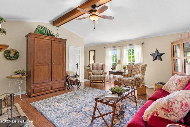 living area with a ceiling fan, wood finished floors, and baseboards