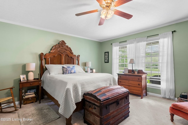 bedroom featuring ornamental molding, carpet floors, ceiling fan, and baseboards