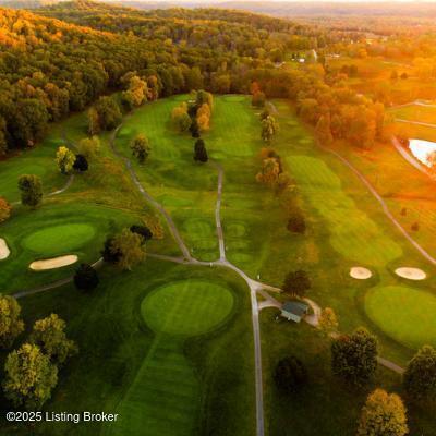 aerial view of a heavily wooded area and a local golf course