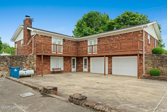 1160 Buck Knobs Rd, Ekron, KY 40117 - view of front of home with brick siding, a chimney, an attached garage, and concrete driveway