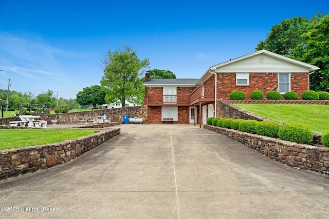 1160 Buck Knobs Rd, Ekron, KY 40117 - view of front facade featuring brick siding, a chimney, an attached garage, concrete driveway, and a front yard