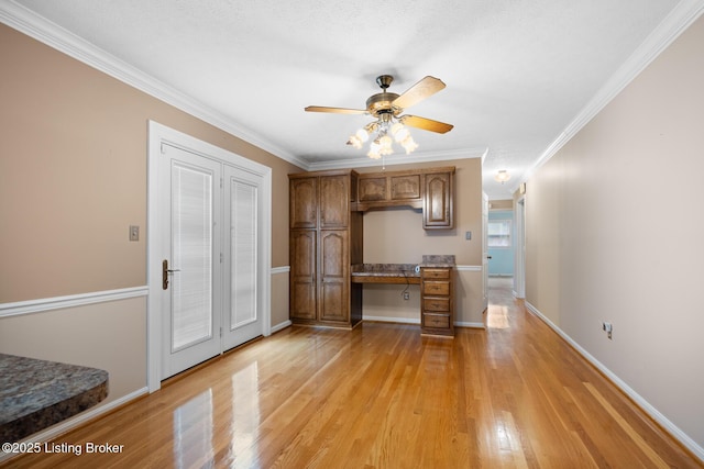 1160 Buck Knobs Rd, Ekron, KY 40117 - kitchen featuring ceiling fan, light wood-style floors, ornamental molding, brown cabinets, and baseboards