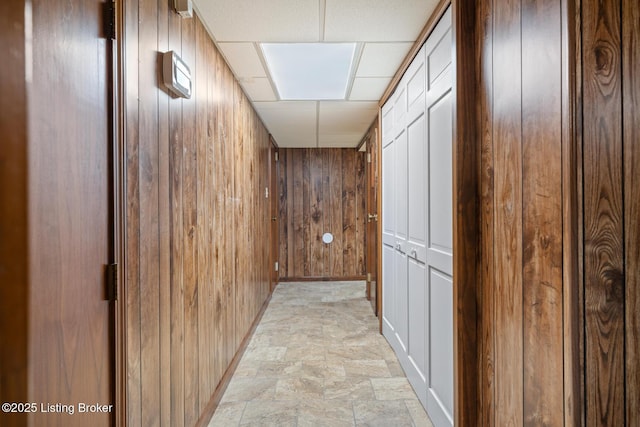 1160 Buck Knobs Rd, Ekron, KY 40117 - hallway featuring stone finish floors, wooden walls, and baseboards