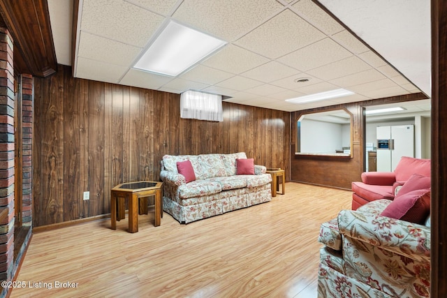 1160 Buck Knobs Rd, Ekron, KY 40117 - living room featuring a paneled ceiling, wood finished floors, and wood walls
