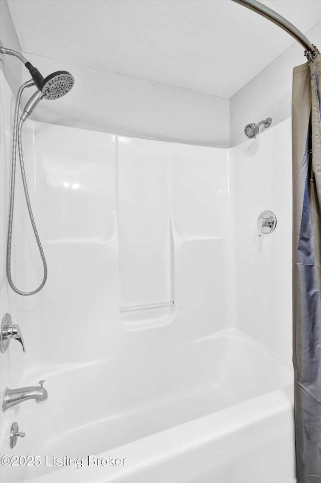 full bathroom featuring shower / bath combo with shower curtain