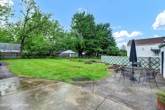 view of yard featuring a patio and outdoor dining space