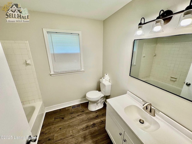105 Rizer Ave, Springfield, KY 40069 - full bath with wood finished floors, toilet, vanity, baseboards, and shower / tub combination